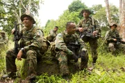 Edgar Hortas, Oriel De Gracia, Walter Pena, Hector Perez, Humberto Barba, and Jonathan J. Diaz laugh in the forest.
