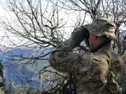 Wendell Sparks looks out his binoculars.