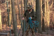 Willy getting rope ready for his tree climb.