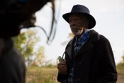 Morgan Freeman watches a drum circle perform on Scugog Island.