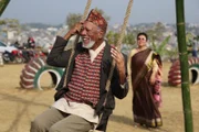 Morgan Freeman swings atop of a mountain in Kathmandu, Nepal.