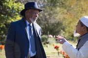 Morgan Freeman talks with Sombat Jitmoud at the Blue Grass Memorial in Lexington, Kentucky.