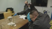 Officers Kenneth Hong, Sapna Chopra, and Ricard Acevedo record artifacts findings of the day. (National Geographic)
