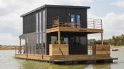 As seen on FIxer Upper, the exterior of the Swartz's remodeled house boat. (After #11)