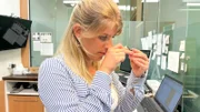 Franzi inspecting jewelry.