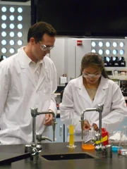 Jarrod in lab with young attractive student.