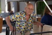 Chris waiting to shoot in golf cart