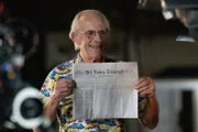 Chris with newspaper.