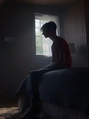 Paul Keller watches a fire burn on TV.