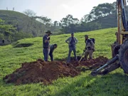 Colin, Jerry, Ramon and Max inspect the dig site.