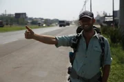 Rob Greenfirld hitching a ride in Brazil with Jams Levelle.