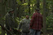 Buck, Jeff and Huck talk in the woods.
