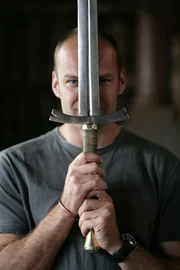 Monty Halls holding a sword.