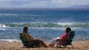 Clients Jim and Margie Boyce relax on the beach on Maui as seen on HGTV's Hawaii Life.