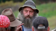 Huckleberry listens as Trapper discusses the investigation.
