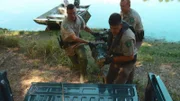Jason Jones, Shawn Hervey, and Daniel Kessler put an alligator in the bed of the truck.