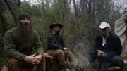 L-R: Matt, Misty and Marty Raney sit outside of their tent.