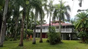 View of the Palm Breeze Exterior, shown to clients Damien and Michelle, in Hilo, Hawaii, as seen on HGTV's Hawaii Life.