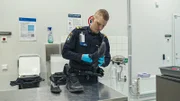 Alexander holding shoe