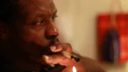 Alaska, USA: A user smoking a crack pipe.