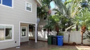 View of the Paradise House yard, shown to clients Amber and Corey Goff, in Ewa, Hawaii, as seen on HGTV's Hawaii Life.