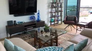 View of the Kai Condo Livingroom, shown to clients Sarah and Jackie, in Honolulu, Hawaii, as seen on HGTV's Hawaii Life.
