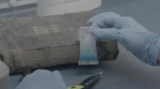 An officer tests a substance found during an inspection.