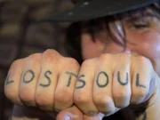 A "Lost Soul" tattoo on Billy, a heroin addict.
