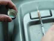 A needle full of heroin.