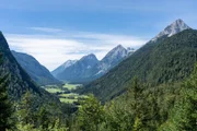 view on wetterstein mountains and leutasch valley from a nearby mountain in summer, bavaria, germany