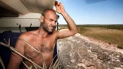 Ed Stafford looks on from a helicopter after spending ten days in Fresh Water Cove about 2650 km north of Perth in Western Australia on Monday 16 September 2013. Ed Stafford spent 10 days shooting his Naked Survivor Australian Episode.