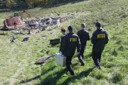 The FBI and the NTSB make their way to the plane wreckage