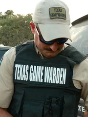 Trent Herchman wears a Texas Game Warden vest.