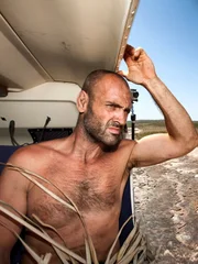 Ed Stafford looks on from a helicopter after spending ten days in Fresh Water Cove about 2650 km north of Perth in Western Australia.
