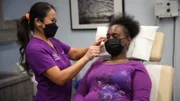 Dr. Lee examines Alexis Douglas eye cyst in the examination room pre-procedure.
