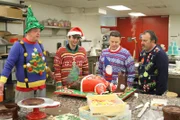 Boys admiring the ugly sweater cake.