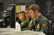 Nogales, Arizona, USA: Border Patrol agents watch surveillance cameras from headquarters to monitor the border of Nogales.