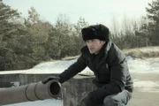 Patrick Bury by the remains of an anti-aircraft gun at the Memel Nord, coastal battery near Klaipeda on the Baltic coast of Lithuania.