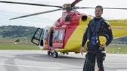 A rescuer standing by the helicopter in rescue gear. (National Geographic/Iona Feeder)