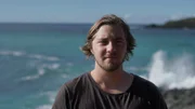 Dylan Briggs standing by the water.  (National Geographic/Iona Feeder)