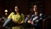 Interviewees, Christian Showalter and Hannah Parrett sat on sofa looking off to the left of the camera.