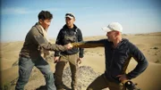 Wu Xin Lei and Ed Stafford looking at each other intensely and having a handshake