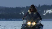 Charlie Wright on a snowmobile.