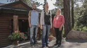 Broker Wendy poses with homeowners Brian and Christina between home showings, as seen on Log Cabin Living.