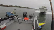 Chris McMahon and Roni jumping off the side of the boat as second boat collides