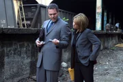 Pictured: (l-r) Vincent D'Onofrio as Det. Robert Goren, Kathryn Erbe as Det. Alex Eames
