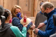 Dr. Jeff Baier, Vet Tech Paty Ubias, and Executive Director Shartrina Kircher consulting animal