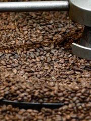 Coffee beans in roasting machine.