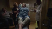 A patient in in a doctors office being examined.