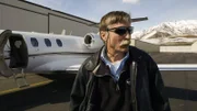 Kevin Lacey stands next to the airplane.